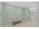 Charming flex space with tile floors, neutral paint, storage, and a cushioned bench at 3012 Grand View Ave, Clearwater, FL 33759