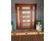 Stylish front door with sidelights and a welcoming porch at 3012 Grand View Ave, Clearwater, FL 33759