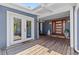 Inviting front porch with wood floors, double doors and a contemporary wood front door at 3012 Grand View Ave, Clearwater, FL 33759
