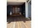 Inviting front porch with wooden deck, offering a warm welcome to this beautifully maintained home at 3012 Grand View Ave, Clearwater, FL 33759