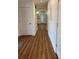 Bright hallway with wood floors, white walls, and doors at 3012 Grand View Ave, Clearwater, FL 33759