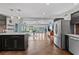 Open-concept kitchen with stainless steel appliances and view of the living room and backyard at 3012 Grand View Ave, Clearwater, FL 33759