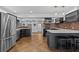 Contemporary kitchen with stainless steel appliances, quartz countertops and bar stool seating at 3012 Grand View Ave, Clearwater, FL 33759