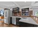 Modern kitchen with stainless steel appliances, quartz countertops, and stylish backsplash at 3012 Grand View Ave, Clearwater, FL 33759