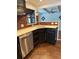 Modern kitchen with stainless steel appliances and dark cabinetry at 3012 Grand View Ave, Clearwater, FL 33759