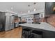 Spacious kitchen with stainless steel appliances, white countertops, and a breakfast bar at 3012 Grand View Ave, Clearwater, FL 33759