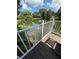 Lake view from deck with modern railings overlooking the lush landscaping at 3012 Grand View Ave, Clearwater, FL 33759