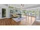 Bright living room with lake view, laminate floors, and stylish decor at 3012 Grand View Ave, Clearwater, FL 33759