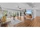 Bright, open living room features laminate floors, comfortable seating and lake views at 3012 Grand View Ave, Clearwater, FL 33759