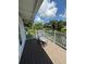 Inviting patio with rocking chair overlooks serene water view at 3012 Grand View Ave, Clearwater, FL 33759