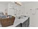 Updated bathroom with modern fixtures, dark gray cabinetry, and ample counter space at 304 Westwinds Dr, Palm Harbor, FL 34683