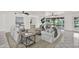 Spacious living room with neutral décor, ceiling fans, and views of the backyard canal at 304 Westwinds Dr, Palm Harbor, FL 34683