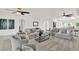 Inviting living room showcasing neutral tones, ceiling fans, and an open layout design at 304 Westwinds Dr, Palm Harbor, FL 34683
