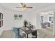 Home office with a ceiling fan and view to a sitting room at 304 Westwinds Dr, Palm Harbor, FL 34683