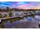 Waterfront property featuring a private dock, offering serene water views and direct access to the waterway for boating at 304 Westwinds Dr, Palm Harbor, FL 34683
