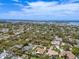 Expansive aerial view of the beautiful homes in a neighborhood with mature trees and manicured lawns at 309 Palmetto Ln, Largo, FL 33770