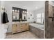 This is a luxurious bathroom with double vanities, a soaking tub and walk-in shower at 309 Palmetto Ln, Largo, FL 33770