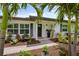 Charming front entrance with lush landscaping and a well-manicured lawn at 309 Palmetto Ln, Largo, FL 33770