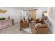 Inviting living room featuring leather seating, neutral colors, and barn doors at 309 Palmetto Ln, Largo, FL 33770