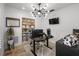 Modern home office featuring a contemporary light fixture and stylish decor at 309 Palmetto Ln, Largo, FL 33770