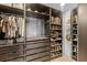 Walk-in closet with multiple shelves and compartments for organized storage at 309 Palmetto Ln, Largo, FL 33770