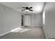 Cozy bedroom with carpet floors, a ceiling fan, and great natural light at 3111 W Douglas St, Tampa, FL 33607