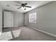 Bedroom featuring neutral paint, plush carpeting, and great natural light at 3111 W Douglas St, Tampa, FL 33607