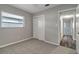 Bedroom with carpet, closet, and a bright window showcasing natural light at 3111 W Douglas St, Tampa, FL 33607