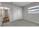 Comfortable bedroom with carpet, window, and a closet near the entryway at 3111 W Douglas St, Tampa, FL 33607