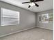 A serene bedroom with neutral walls, plush carpeting, and ample natural light at 3111 W Douglas St, Tampa, FL 33607