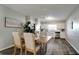 Open dining area featuring stylish table and chairs that connect seamlessly to the kitchen at 3111 W Douglas St, Tampa, FL 33607