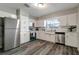 Modern kitchen with stainless steel appliances, ample cabinet space, and sleek countertops at 3111 W Douglas St, Tampa, FL 33607