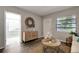 Stylishly decorated living room with hardwood floors and view to the front door entrance at 3111 W Douglas St, Tampa, FL 33607