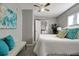 Comfortable bedroom with a ceiling fan, and a doorway to the Primary bathroom at 3111 W Douglas St, Tampa, FL 33607