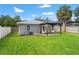 A spacious backyard features a covered patio with outdoor furniture at 3135 W Varn Ave, Tampa, FL 33611