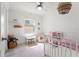 Bright bedroom featuring pink decor, toys and light at 3135 W Varn Ave, Tampa, FL 33611