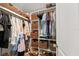 Walk-in closet with custom storage solutions and built-in shelving at 3135 W Varn Ave, Tampa, FL 33611