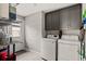 Functional laundry room equipped with modern washer and dryer at 3135 W Varn Ave, Tampa, FL 33611