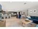 Open-concept living space with kitchen, dining area, and a cozy living room with modern furnishings at 3135 W Varn Ave, Tampa, FL 33611