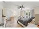 Bright main bedroom featuring french doors to outdoor space and ensuite bath at 3135 W Varn Ave, Tampa, FL 33611