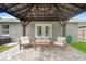 Covered patio area with comfortable seating and brick pavers at 3135 W Varn Ave, Tampa, FL 33611