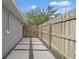 A side yard features a walkway of pavers, a wood fence, and decorative rock at 3135 W Varn Ave, Tampa, FL 33611