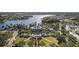 Aerial view of the community clubhouse, a pool, and other amenities with palm trees at 315 Blackrock Ln, Apollo Beach, FL 33572