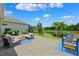 Paver patio features outdoor seating and beautiful views of the water in this serene backyard at 315 Blackrock Ln, Apollo Beach, FL 33572