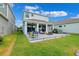 Backyard features a patio with an outdoor kitchen and ample seating for entertaining at 315 Blackrock Ln, Apollo Beach, FL 33572