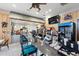 Community bar area features indoor seating, granite countertops, beverage selections, and a flat screen television at 315 Blackrock Ln, Apollo Beach, FL 33572