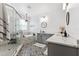 Stylish bathroom features a glass shower, soaking tub, and double vanity with quartz countertops at 315 Blackrock Ln, Apollo Beach, FL 33572