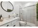 Bathroom featuring vanity, mirror and glass shower at 315 Blackrock Ln, Apollo Beach, FL 33572