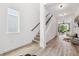 Bright foyer with hardwood floors and staircase leading to the upper level at 315 Blackrock Ln, Apollo Beach, FL 33572