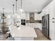 Gourmet kitchen with a large island, stainless steel appliances, and custom cabinetry at 315 Blackrock Ln, Apollo Beach, FL 33572